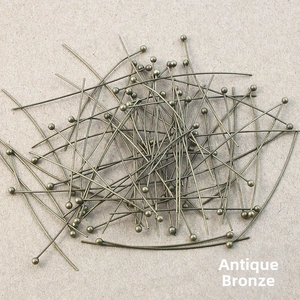 Macro shot of antique bronze finish metal ball head pins for DIY jewelry making