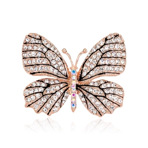 Elegant rose gold butterfly brooch with shimmering white and colored crystals on white base