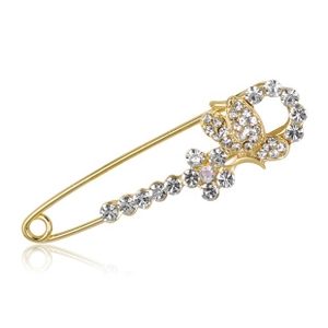 Close-up of a golden safety pin brooch with sparkling rhinestones and butterfly design