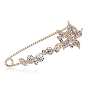 Detailed macro of crystal-encrusted floral brooch pin with sparkling rhinestones
