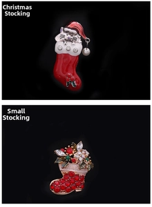 Detailed view of Christmas stocking brooches with sparkling crystals and pearl pendants