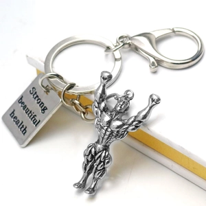 Macro detail of antique silver dumbbell pendant with strong beautiful health engraving