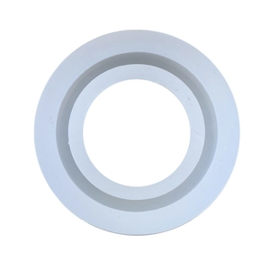Macro shot of circular silicone resin mold featuring concentric rings and matte finish