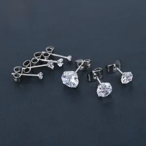 Detailed macro view of multi-size round cubic zirconia stud earrings with four-prong settings