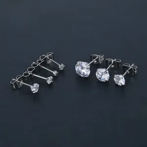 Macro shot of silver stainless steel zircon stud earrings in various sizes and four-prong sets