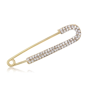 Detailed view of a gold safety pin brooch with two rows of sparkling rhinestones