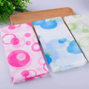Detailed texture of colorful nylon exfoliating back scrubbers in pink, blue, and green
