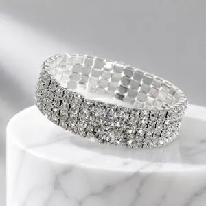Detailed view of four-row rhinestone elastic bracelet with silver metal base finish