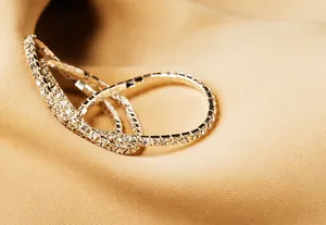 Macro shot of multi-row elastic bracelet with white square-cut diamonds on silver base
