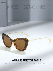 Detailed macro view of tortoiseshell cat-eye sunglasses with slim gold metal temples