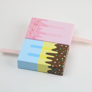 Detail of pink and blue ice cream shaped cardboard candy boxes with creative popsicle handles