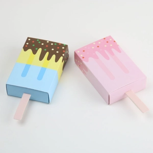 Flat lay of creative ice cream shaped paper candy boxes in chocolate and strawberry styles