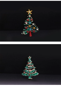 Close-up of alloy Christmas tree brooches with vintage gold plating and colorful rhinestones