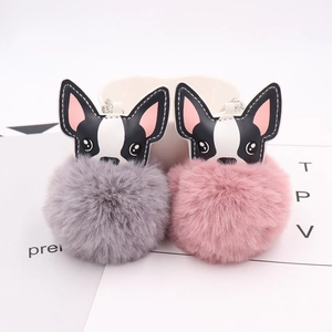 Detailed view of gray and pink puppy pompom keychains with PU leather frenchie heads