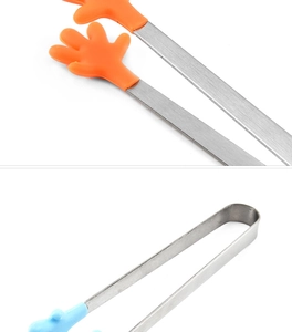 Detail of mini stainless steel food tongs with orange and blue palm-shaped silicone heads