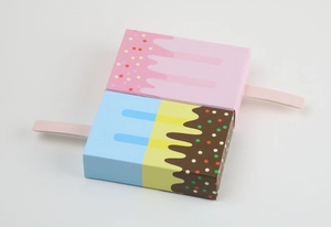 Creative ice cream shaped gift boxes with colorful sprinkle designs on white background