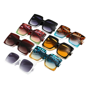 Various stylish oversized square sunglasses in multiple colors on a clean white background