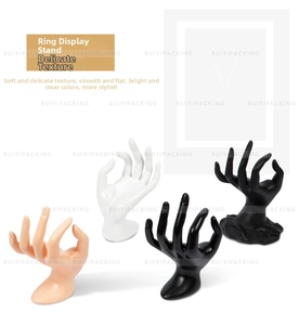 OK-shaped jewelry hand display in skin, white, gloss black, and matte black finishes