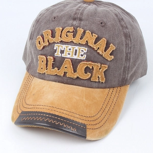 Vintage washed cotton baseball cap with embroidered letters and contrast suede brim