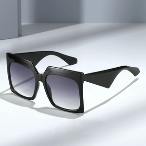 Fashionable oversized square black sunglasses with gradient lenses and thick temples