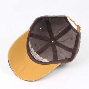Vintage washed cotton baseball cap in brown and yellow featuring breathable eyelets