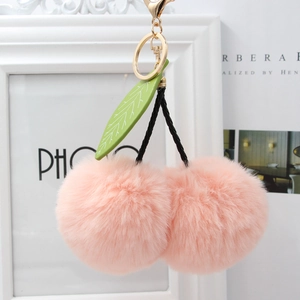 Pink faux fur cherry pom pom keychain with green leaves and gold lobster clasp