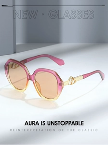 Detail of trendy oval sunglasses with gradient frames and golden metal hollowed temples