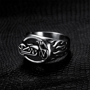 Vintage stainless steel motorcycle ring with detailed flame relief and biker style design