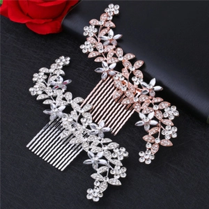 Detail of silver and rose gold bridal hair combs with crystals and floral leaf design