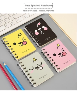 Close-up of four mini A7 spiral notebooks with cute animal designs and positive quotes