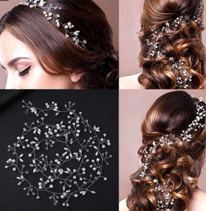 Detail of bridal hair vine with white pearls and crystals woven into a silver wire