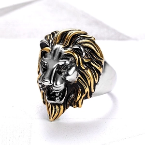 Macro shot of two-tone lion head ring featuring gold plating and vintage silver finish