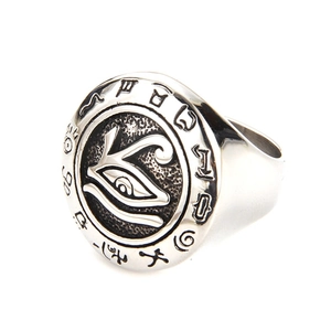 Detail of vintage silver ring featuring embossed Eye of Horus and ancient Egyptian runes