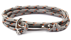 Detail of multi-layer paracord bracelet with industrial silver hammer metal clasp