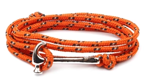 Close-up of orange braided rope bracelet featuring a unique silver hammer-shaped metal clasp