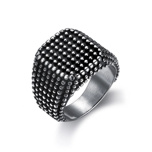 Detail of lion head ring featuring relief metal grains and brushed inner surface