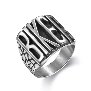 Punk style stainless steel biker ring featuring BITCH embossed letters and textured band