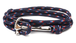 Detail of multi-layer navy braided cord bracelet featuring a silver hammer-shaped clasp
