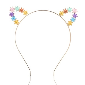 Detail of gold cat ear headband with colorful small flowers on white background