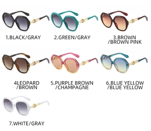 Detailed showcase of oval sunglasses in seven colors with decorative hollow gold temples