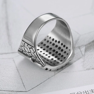Punk rocker stainless steel biker ring with geometric side engravings and inner black dots
