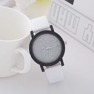 Detail of silver glitter dial watch with white leather strap and crescent moon hand
