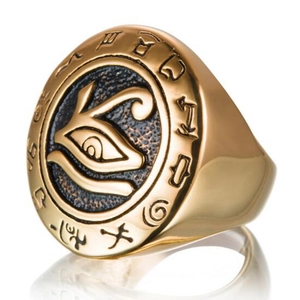 Macro shot of gold Horus eye engraving on vintage stainless steel ring for men