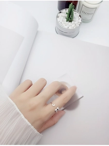 Silver adjustable open ring featuring cute cat ears and tail design worn on finger
