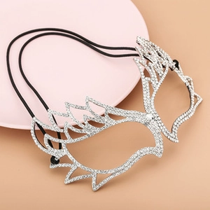 Detail of silver rhinestone spider web mask with black elastic headband for wedding