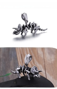 Detailed close-up of a 316L stainless steel triceratops skeleton pendant with retro finish