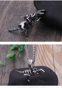 Detail view of silver stainless steel triceratops skeleton pendant with twist chain