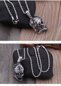 Macro detail of a vintage pirate skull pendant in antique silver with carved helmet
