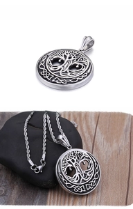 Detailed view of Tree of Life pendant with Celtic knot border and twisted rope chain