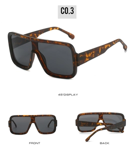 Detail view of oversized square leopard print sunglasses with gray polarized lenses